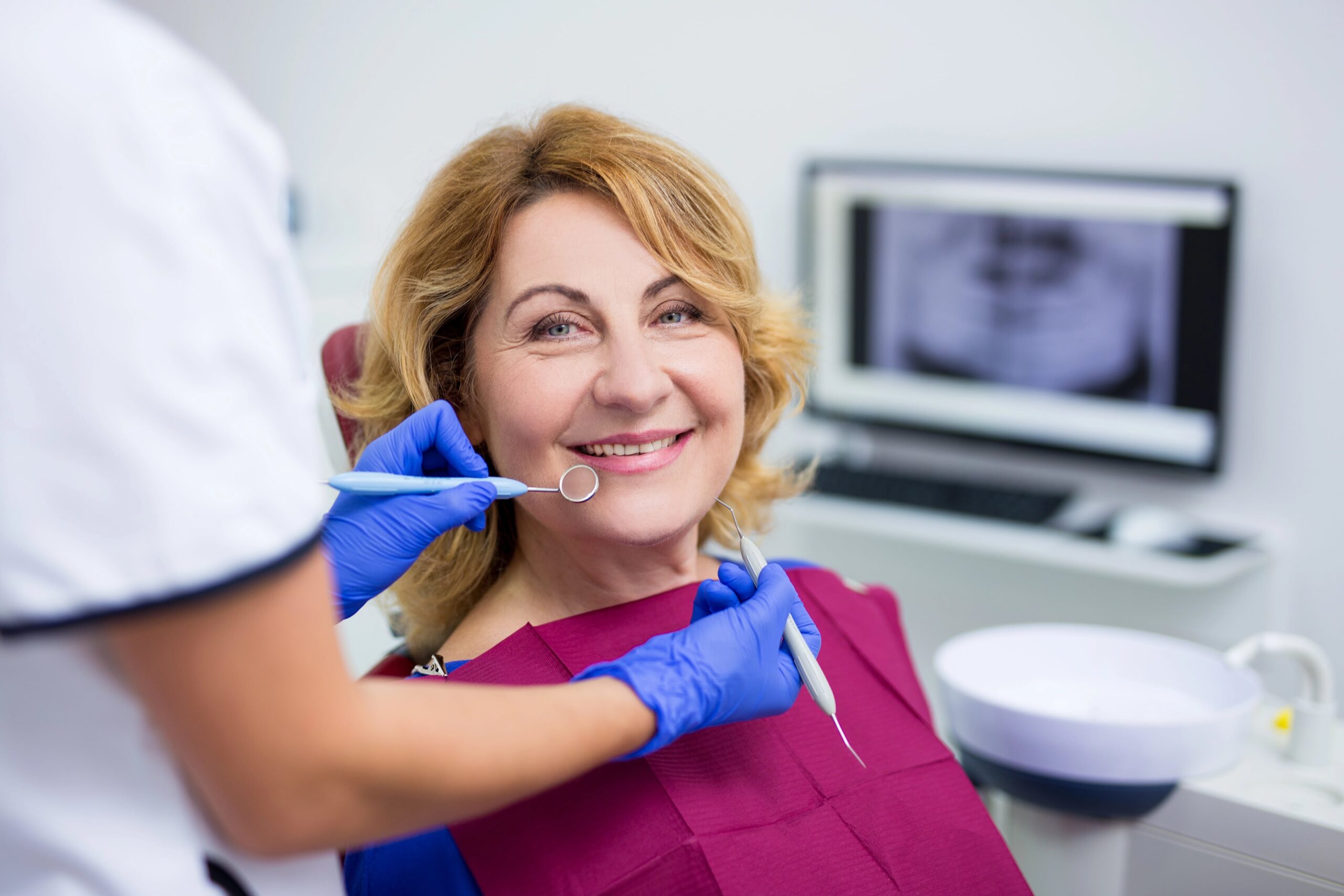 Smiling woman at dental office